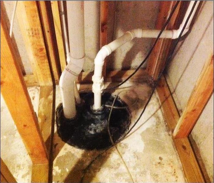 sump pump in basement with demolition