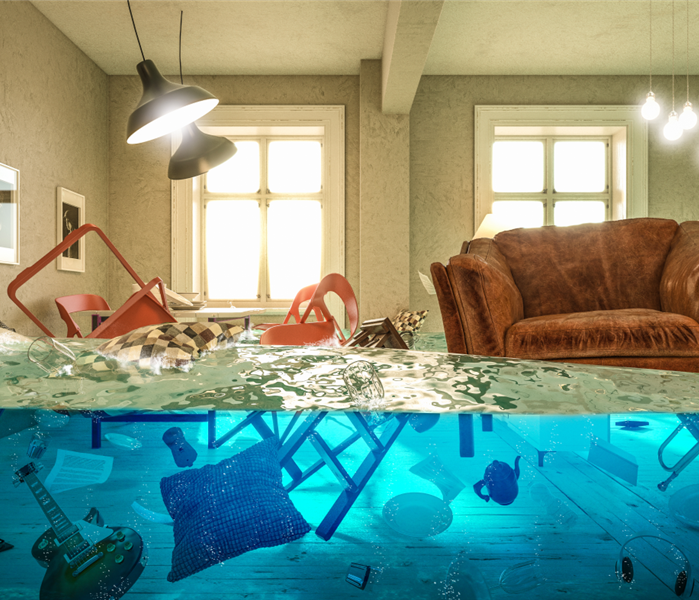 flooded family room with small couch and musical instruments floating